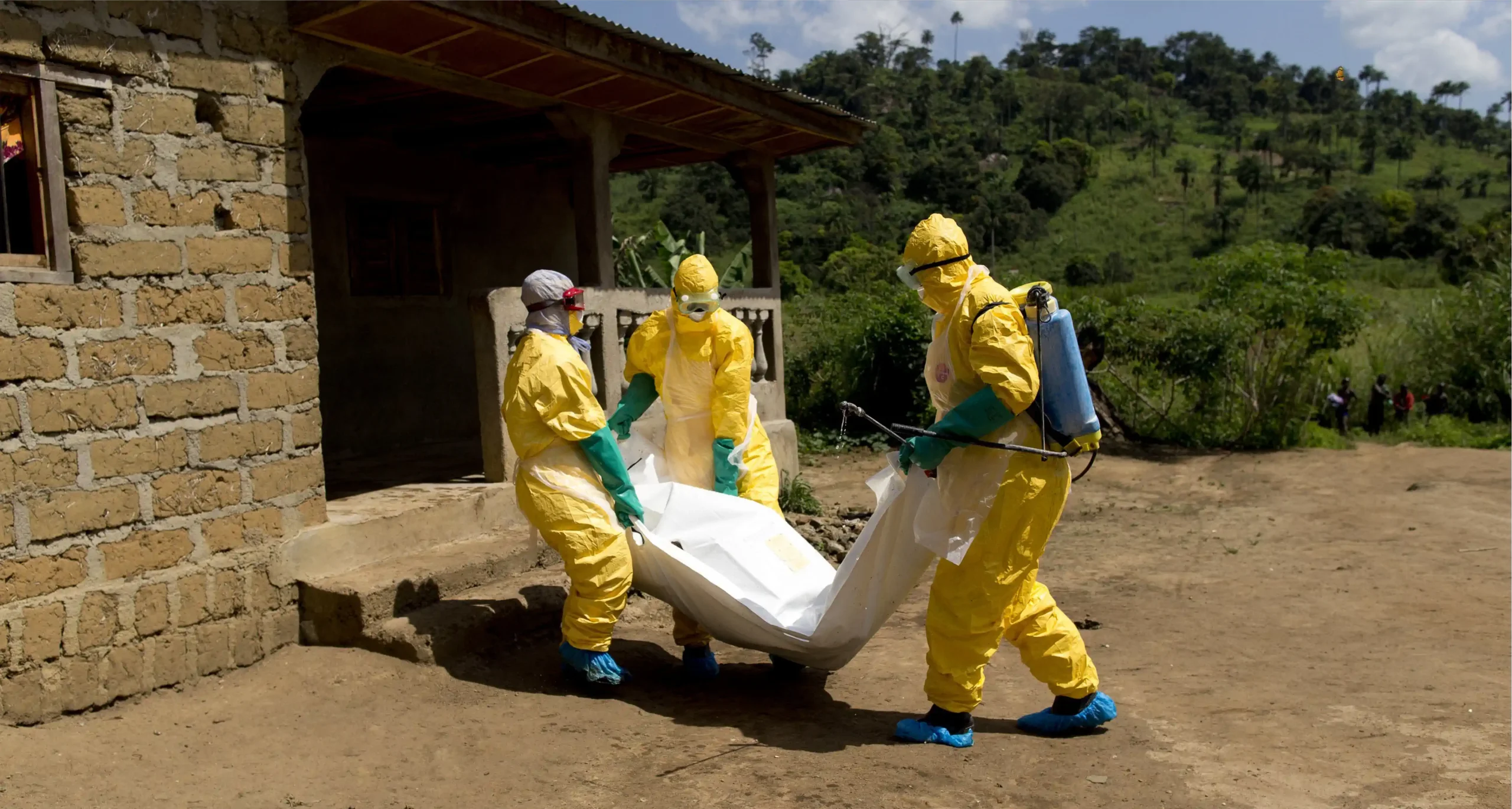 Guinean Red Cross workers carrying the corpse of a victim of Ebola during the 2014-2016 epidemic