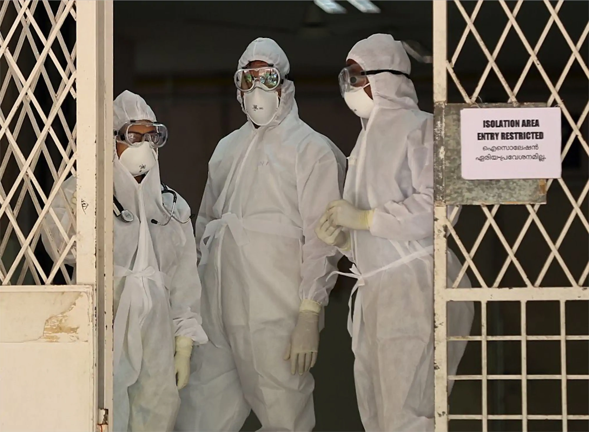 Medical staff wearing full personal protective equipment during a Nipah outbreak